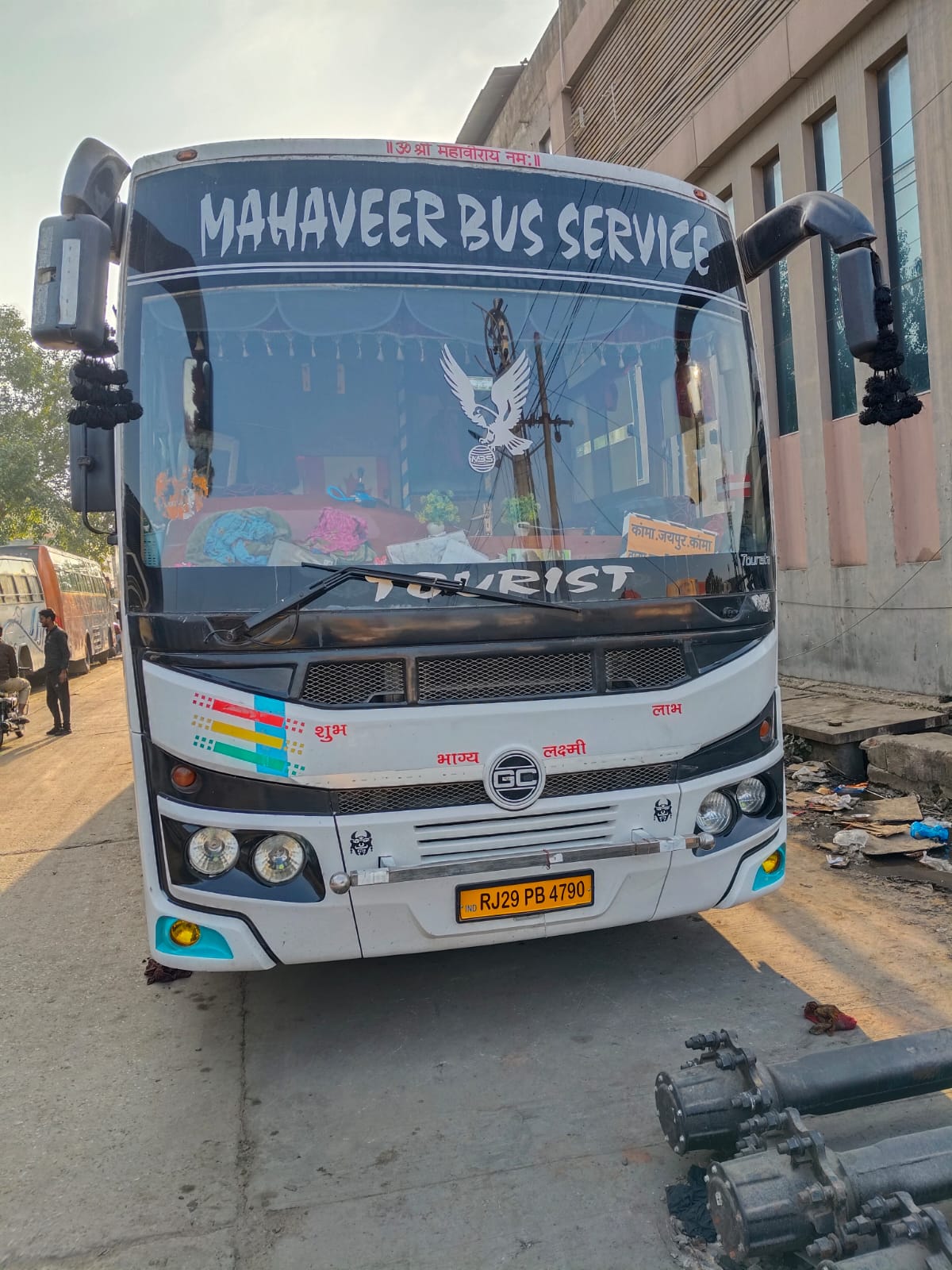 Tourist coach front view in the teal and white livery