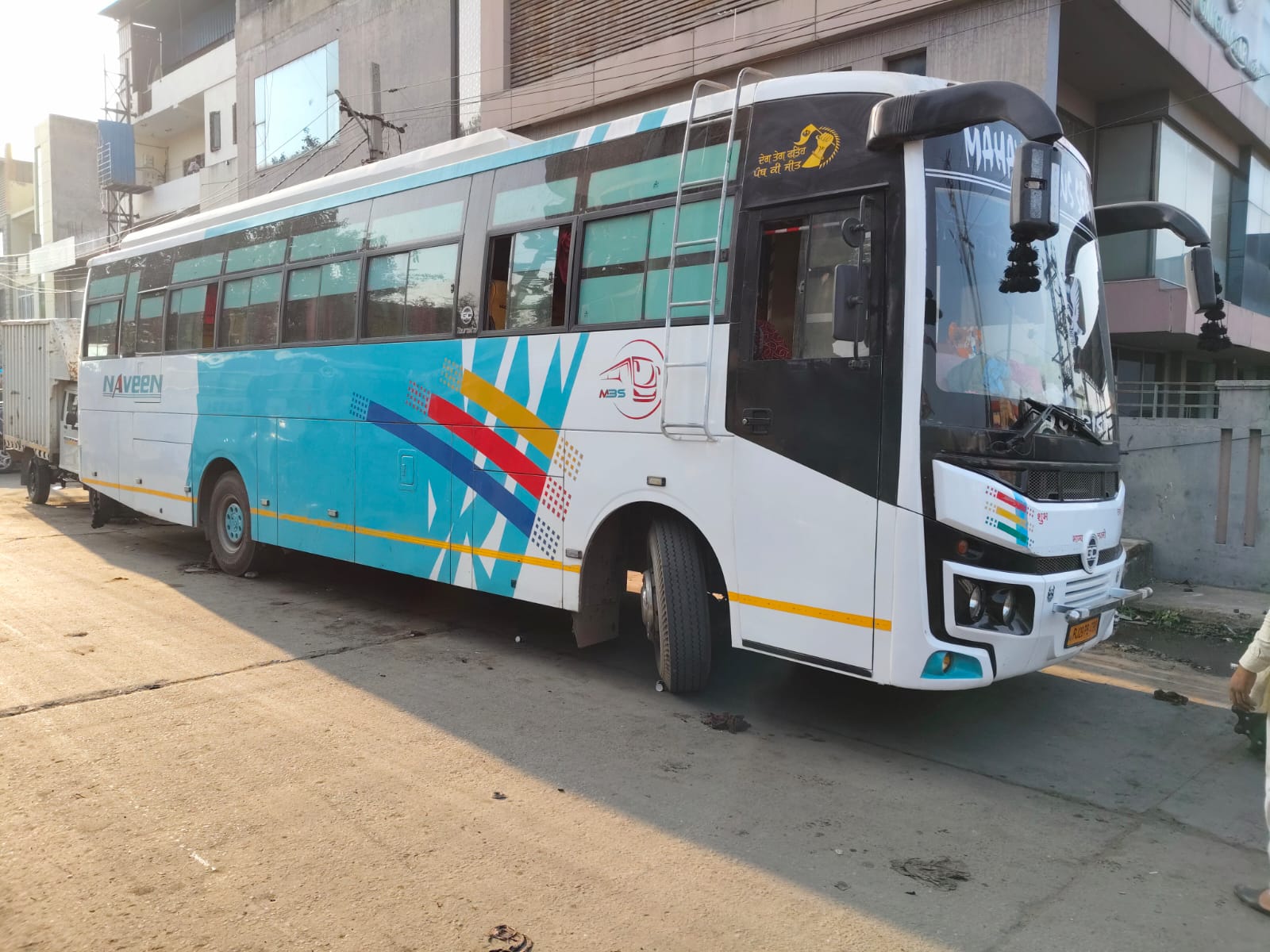 Teal and white coach, front and side view